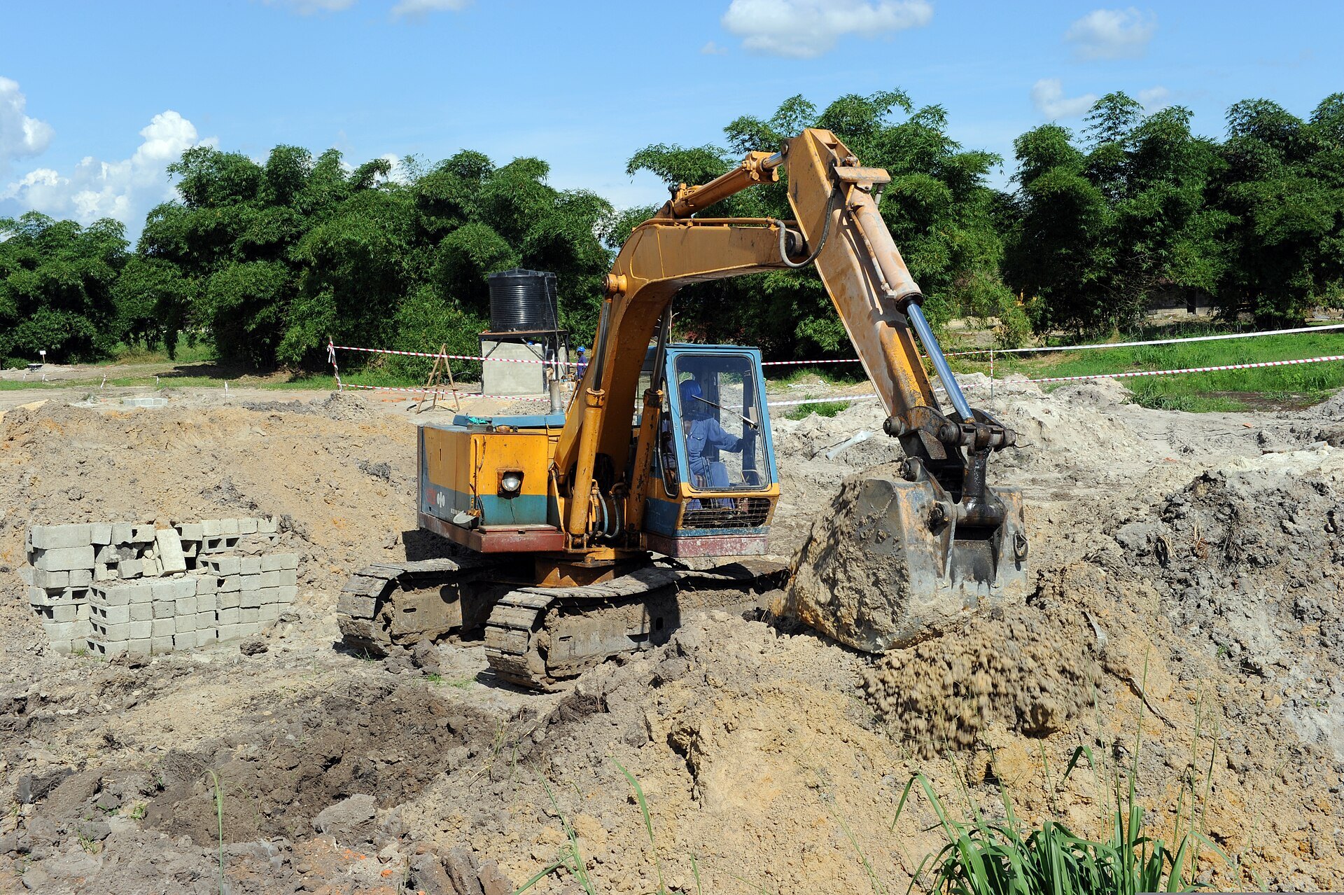 Tracked excavator working at an African construction site